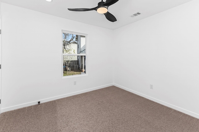 unfurnished room with ceiling fan and carpet flooring