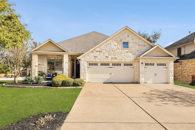 view of front facade featuring a front lawn and a garage