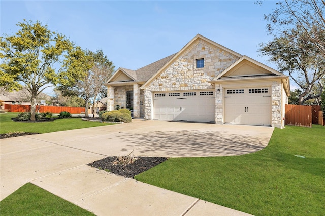 craftsman-style house featuring a garage and a front yard