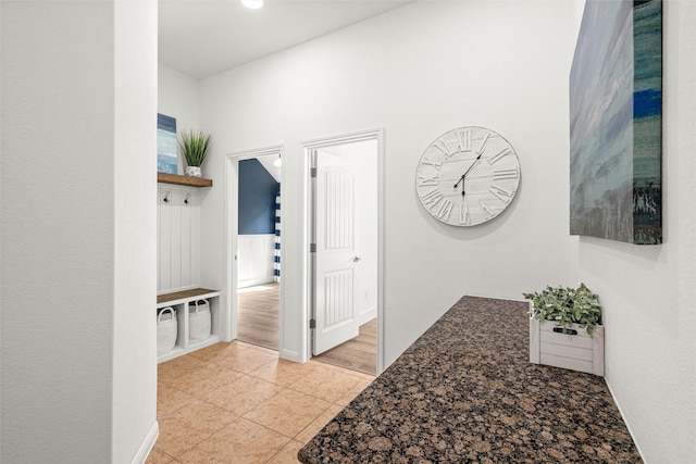 hallway featuring light tile patterned floors