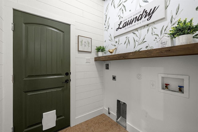 laundry area featuring wood walls, gas dryer hookup, hookup for a washing machine, and hookup for an electric dryer