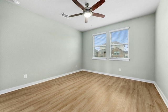 unfurnished room featuring ceiling fan, baseboards, visible vents, and light wood-type flooring