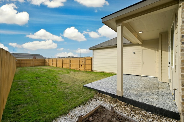 view of yard with a patio area and a fenced backyard