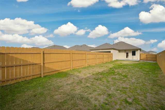 view of yard featuring a fenced backyard