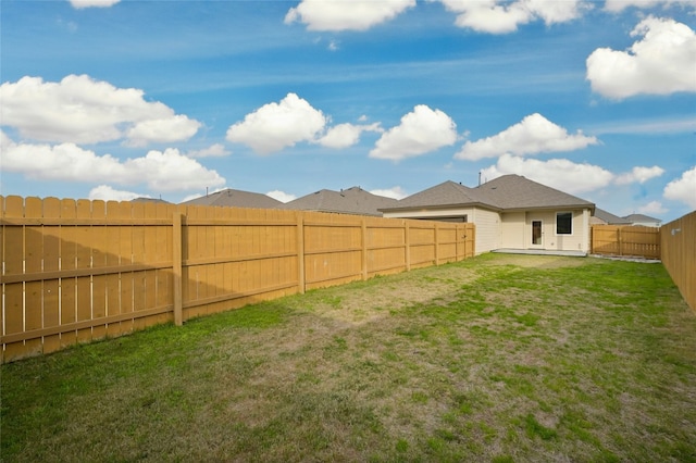 view of yard with a fenced backyard and a patio area