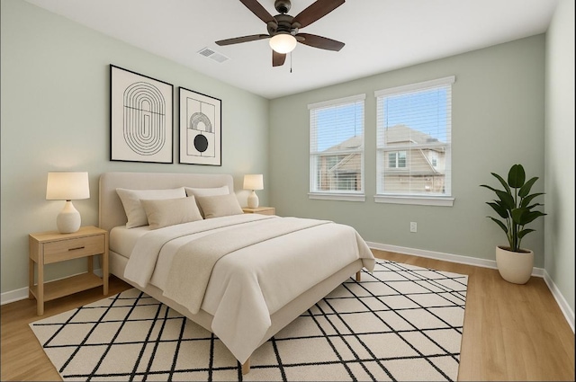 107 Dedina Dr, Georgetown, TX 78626 - bedroom with light wood-style floors and a ceiling fan