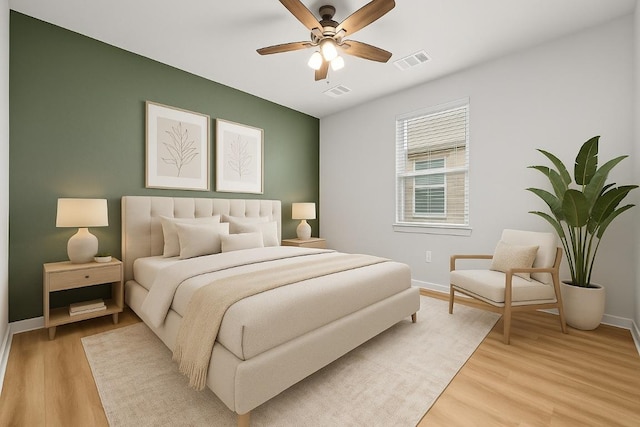 107 Dedina Dr, Georgetown, TX 78626 - bedroom with light wood-style floors and a ceiling fan