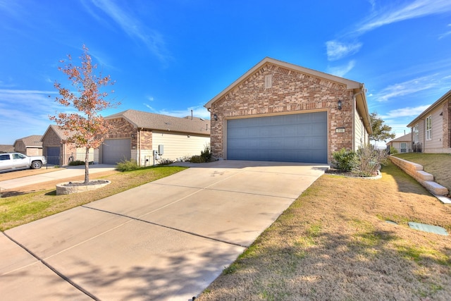 view of front of home with a garage and a front yard