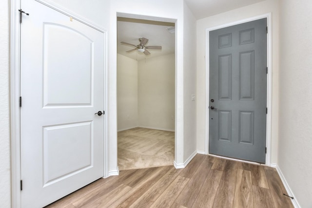 entrance foyer featuring ceiling fan and wood-type flooring