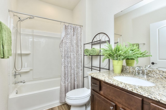 full bathroom with toilet, vanity, hardwood / wood-style flooring, and shower / bathtub combination with curtain