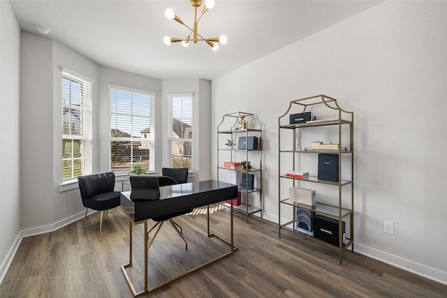 home office featuring a healthy amount of sunlight, dark hardwood / wood-style floors, and an inviting chandelier