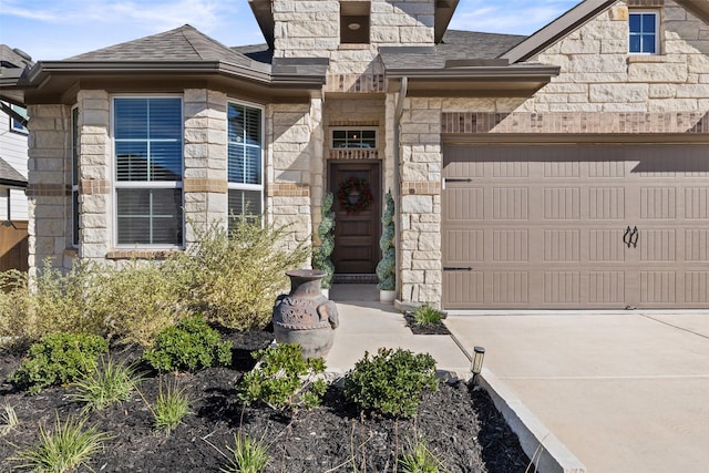 doorway to property featuring a garage