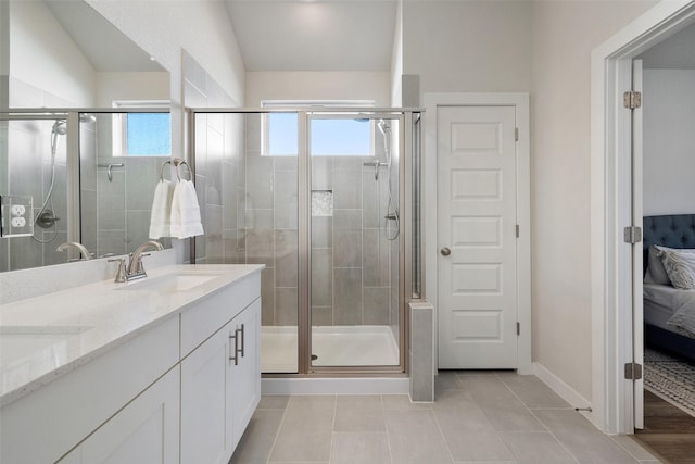 bathroom with vanity, lofted ceiling, tile patterned floors, and an enclosed shower