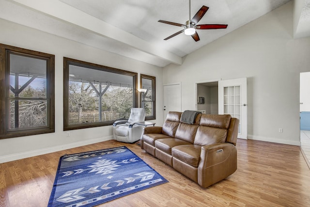 living room featuring vaulted ceiling, ceiling fan, and hardwood / wood-style floors