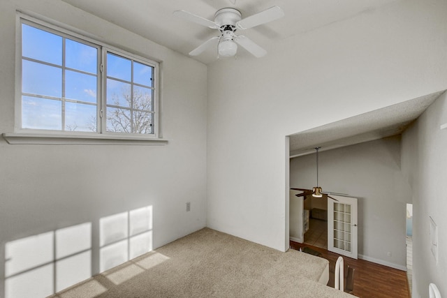 interior space featuring ceiling fan, light hardwood / wood-style floors, a closet, and vaulted ceiling