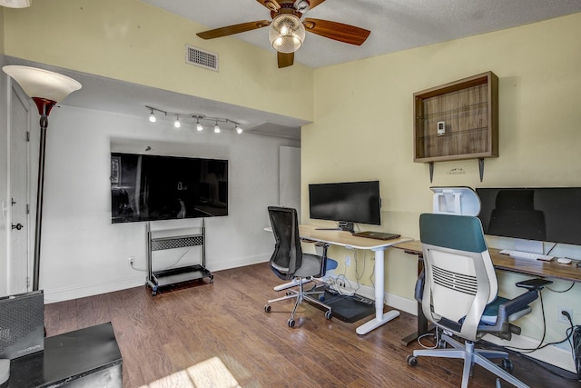 home office featuring a textured ceiling and hardwood / wood-style floors