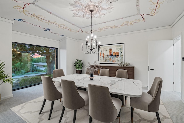 carpeted dining area featuring a raised ceiling, a chandelier, and ornamental molding