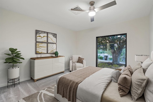 bedroom featuring ceiling fan and light carpet