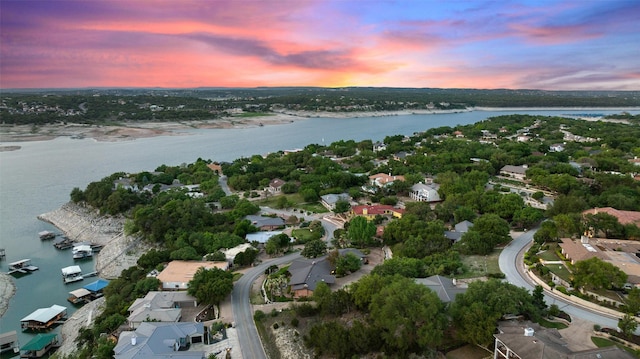 aerial view at dusk with a water view