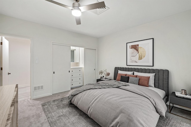 bedroom with ceiling fan and light colored carpet