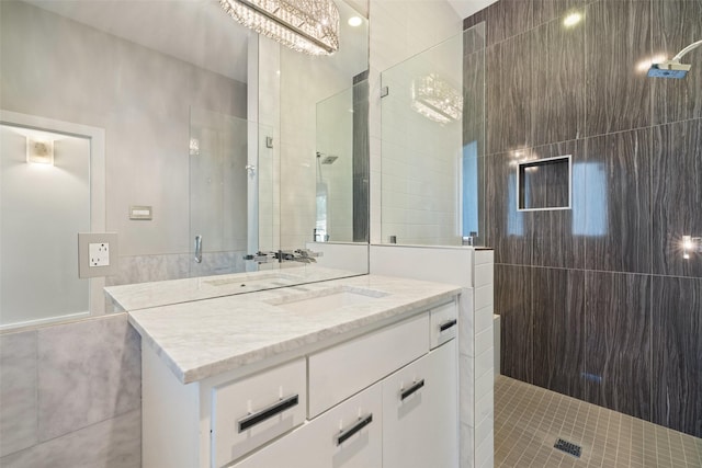 bathroom featuring vanity and a shower with shower door