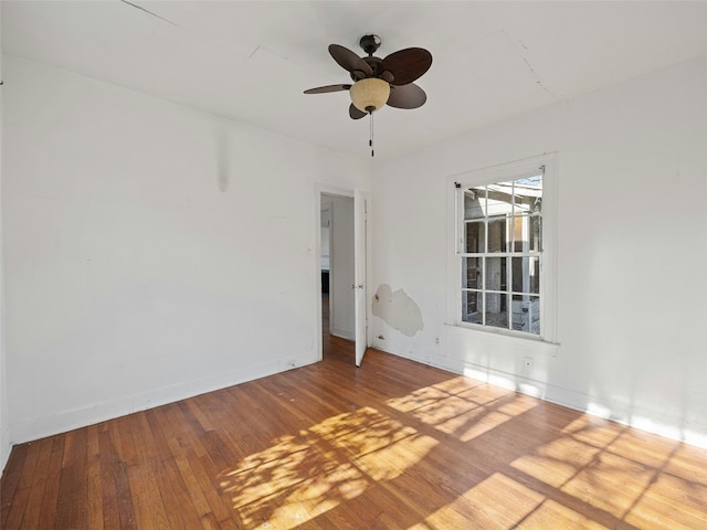 unfurnished room featuring ceiling fan and hardwood / wood-style flooring