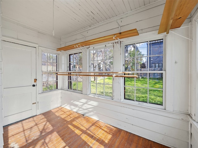 unfurnished sunroom featuring a wealth of natural light