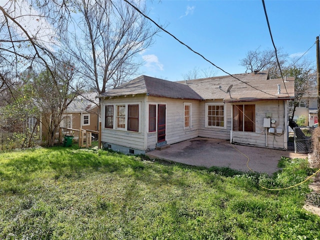 rear view of house with a patio area and a yard