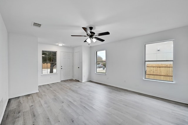 empty room featuring ceiling fan and light wood-type flooring