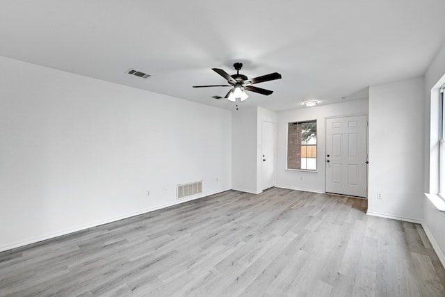 spare room featuring ceiling fan and light wood-type flooring