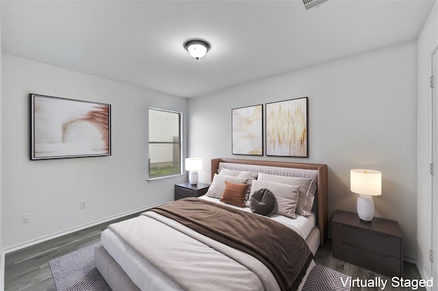 bedroom featuring dark wood-type flooring