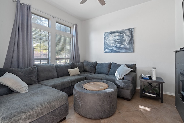 tiled living room with ceiling fan