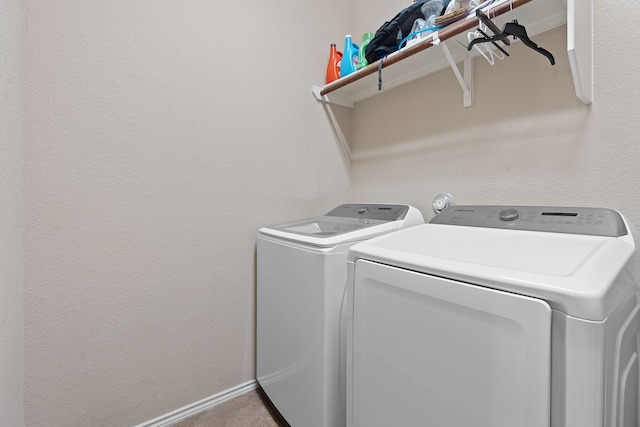 washroom with washer and dryer