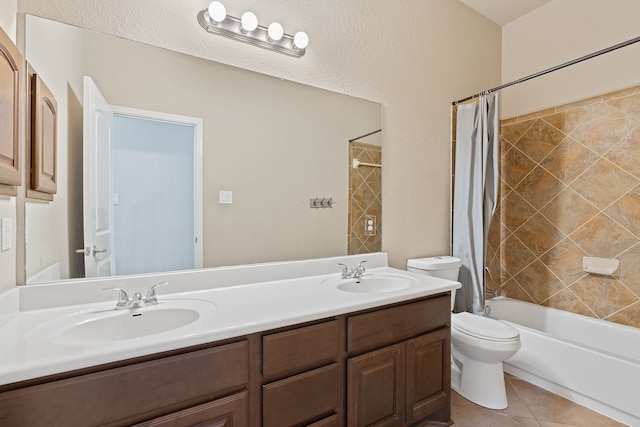 full bathroom featuring toilet, vanity, tile patterned flooring, and shower / bath combo