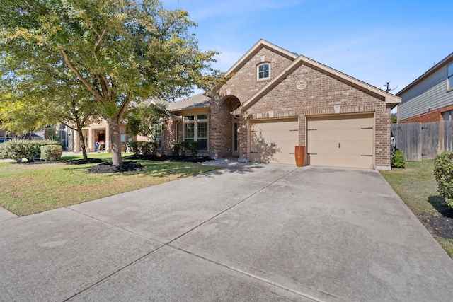 view of front of house with a garage and a front yard