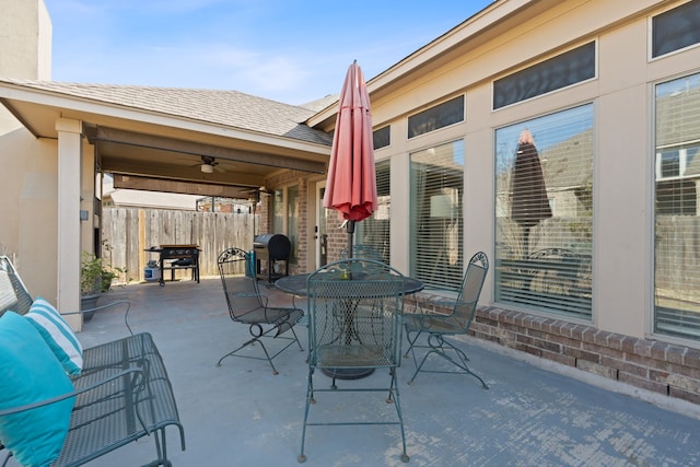 view of patio with ceiling fan and area for grilling