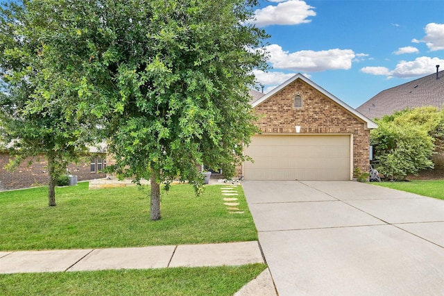 obstructed view of property with a garage and a front lawn