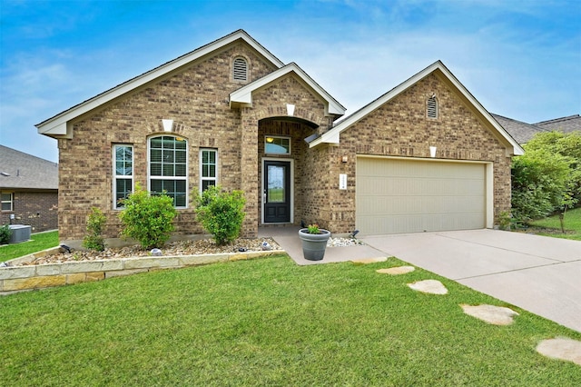 view of front of property featuring a front lawn, a garage, and cooling unit