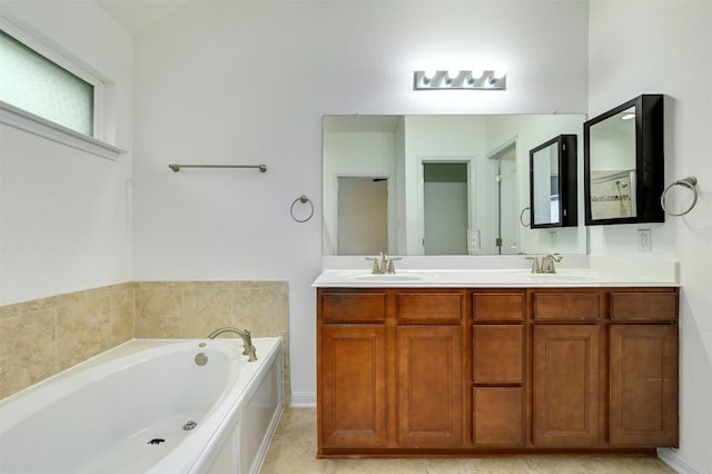 19609 Drifting Meadows Dr, Pflugerville, TX 78660 - bathroom with double vanity, a bath, and baseboards