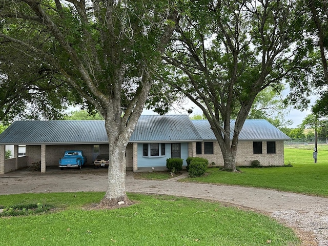 single story home with a front lawn and a carport