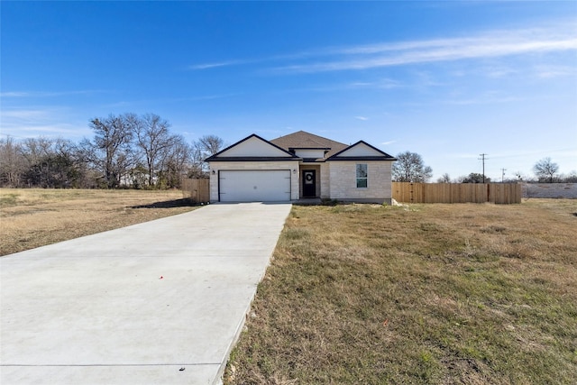 ranch-style house with a garage and a front yard