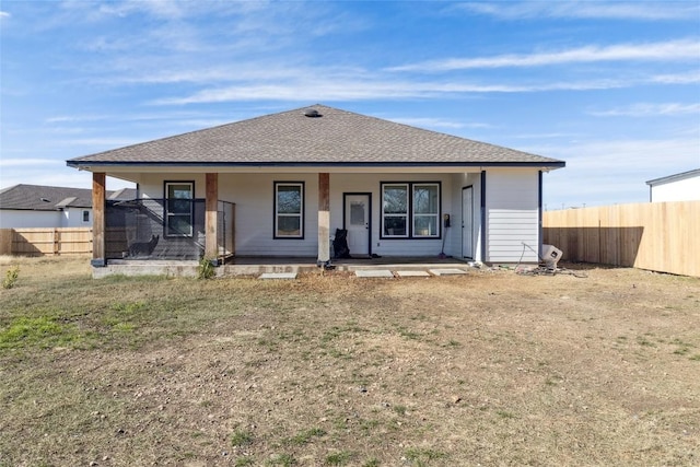 111 Lavender Cv, Dale, TX 78616 - rear view of property featuring roof with shingles and covered porch