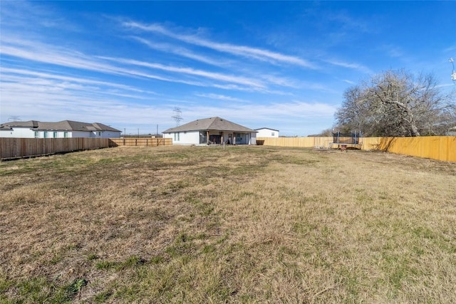 111 Lavender Cv, Dale, TX 78616 - view of yard with a trampoline