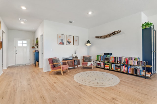 living area with light hardwood / wood-style floors