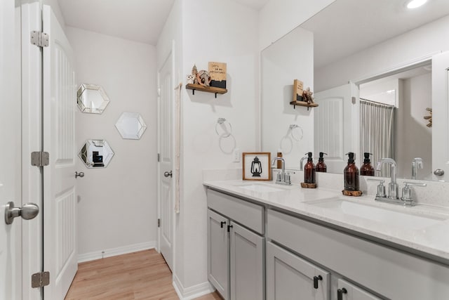 bathroom featuring vanity and hardwood / wood-style floors