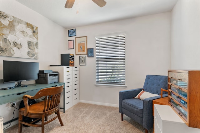 office area featuring ceiling fan and light colored carpet