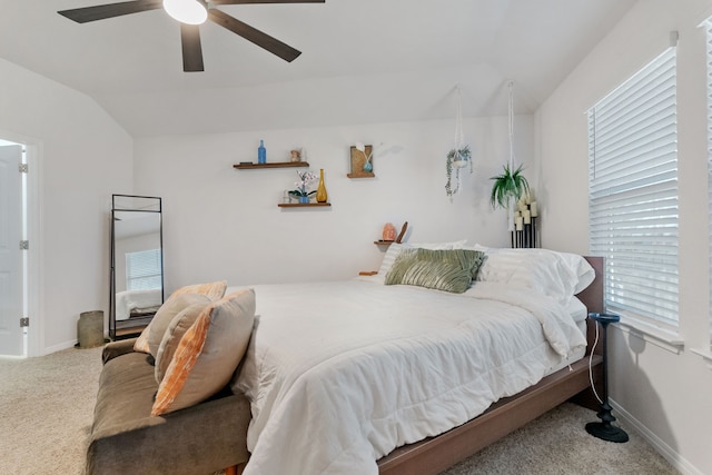 bedroom with ceiling fan, light colored carpet, and lofted ceiling