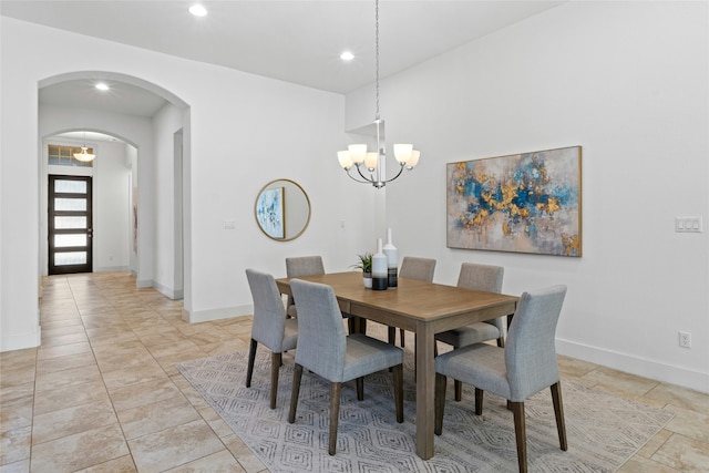 dining area featuring an inviting chandelier