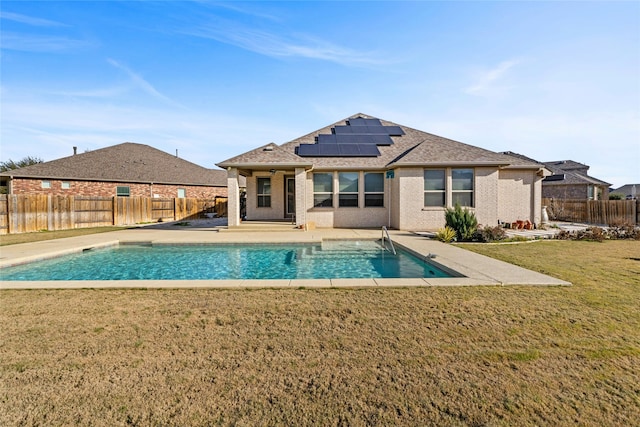 view of pool featuring a patio area and a yard