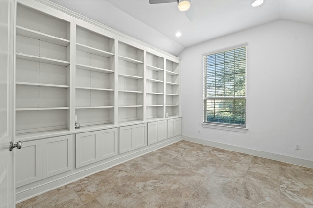 spare room featuring ceiling fan and lofted ceiling